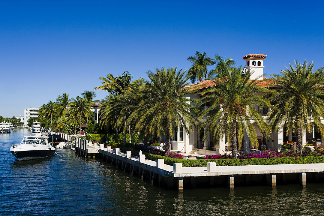 Waterfront estate with a yacht at the dock on the Intracoastal in Fort Lauderdale